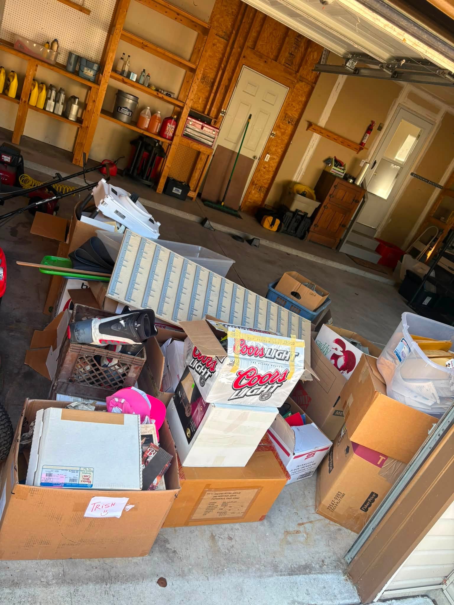 Garage packed with boxes and household items before cleanout